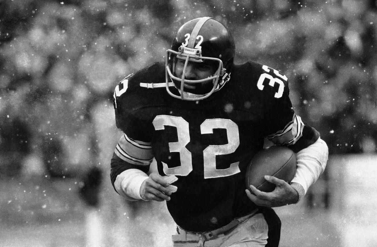 Franco Harris of the Steelers dances past Seattle Seahawks linerbacker Keith Butler (53) in first period action Sunday, Sept. 10, 1978 in Pittsburgh. Harris picked up five yards on the play. Harris is the eight leading rusher in NFL history. (AP Photo/RCG)