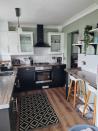 <p>It looks completely new! We're crushing on the dark-hued cabinets, which add a grown-up feel to the space. </p>