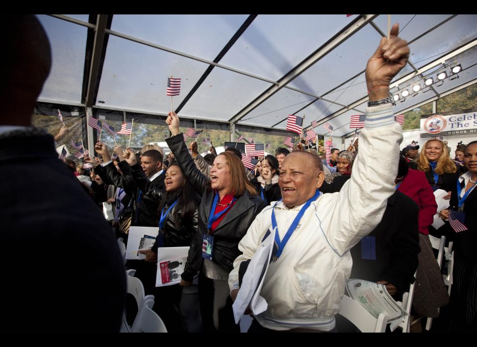 NEW YORK - OCTOBER 28:  New citizens cheer and wave American flags at the end of their naturalization ceremony at Liberty Island on October 28, 2011 in New York City.  125 citizens were naturalized in honor of the Statue of Liberty's 125th birthday.  One hundred and twenty five citizens were naturalized in honor of the Statue of Liberty's 125th birthday.  (Photo by Michael Nagle/Getty Images)