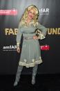 <p>Ellie Goulding lit up the carpet as Dolly Parton at 2017's amfAR & The Naked Heart Foundation Fabulous Fund Fair in NYC. Her sparkly boots and big hair perfectly mimicked the "Jolene" singer. </p>