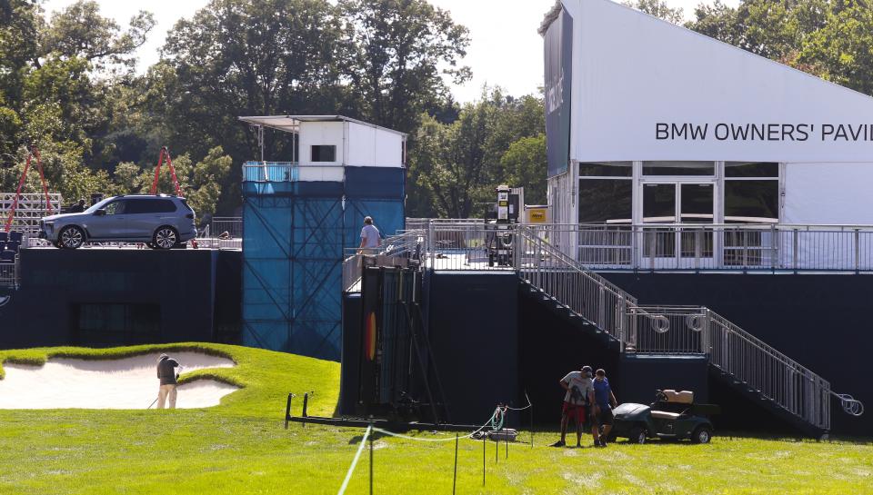 Spectator amenities are prepared around the 17th green at the Wilmington Country Club as the course is readied for the PGA's BMW Championship Friday, August 12, 2022.