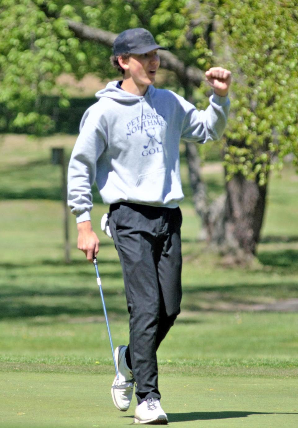 Petoskey's Nolan Jarvis celebrates a successful putt on Wednesday in Gaylord.