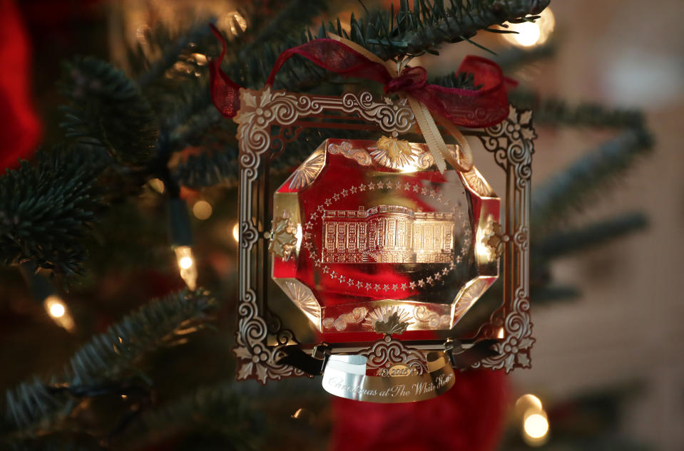 The First Family’s official Christmas ornament is displayed at the White House November 26, 2018 in Washington, D.C. The 2018 theme of the White House holiday decorations is ‘American Treasures,’ and features patriotic displays highlighting the country’s ‘unique heritage.’ The White House expects to host 100 open houses and more than 30,000 guests who will tour the topiary trees, architectural models of major U.S. cities, the Gold Star family tree and national monuments in gingerbread. (Photo: Chip Somodevilla/Getty Images)