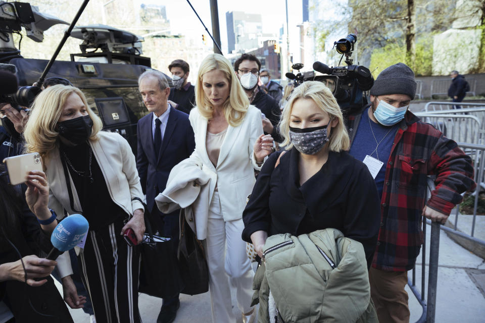 Accuser Danielle Bensky, at right, departs following Ghislaine Maxwell's appearance in Federal Court on Friday, April 23, 2021, in New York. Ghislaine Maxwell, a British socialite and one-time girlfriend of Epstein, pleaded not guilty to sex trafficking conspiracy and an additional sex trafficking charge that were added in a rewritten indictment released last month by a Manhattan federal court grand jury. (AP Photo/Kevin Hagen)