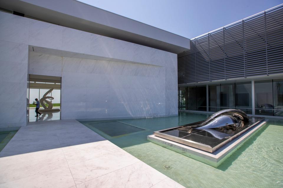 a white building and walkway at mansion The One Bel Air