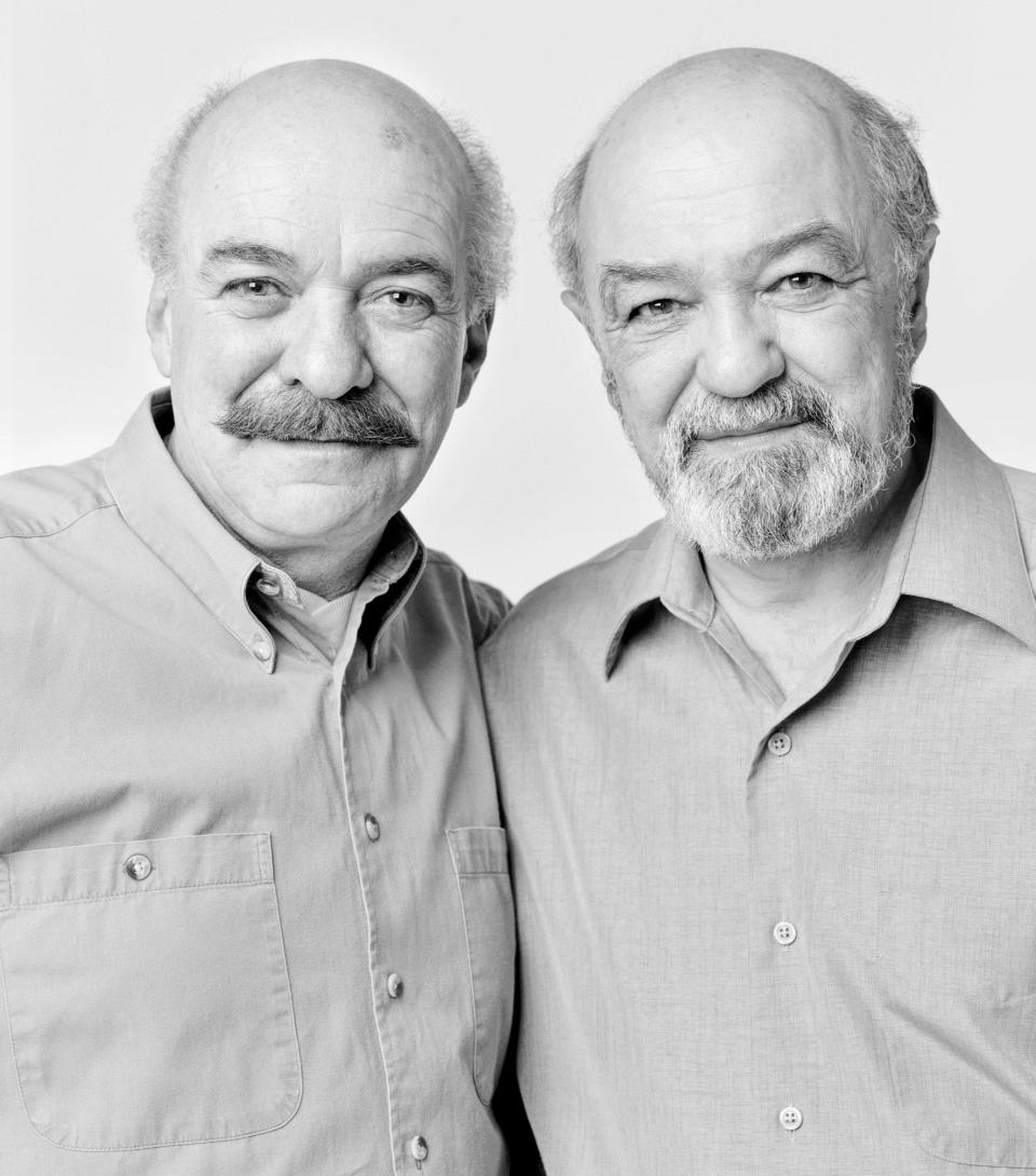 two look alike men, bald with mustaches