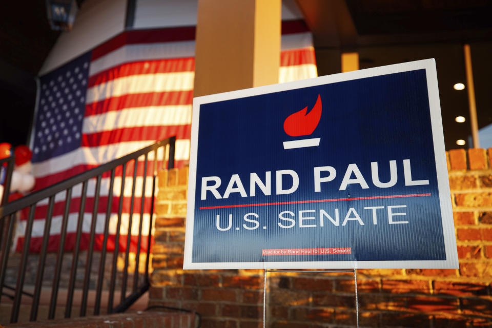 Signs are set up at Sen. Rand Paul's, R-Ky, election night watch party at Bowling Green Country Club in Bowling Green, Ky., Tuesday, Nov. 8, 2022. (AP Photo/Michael Clubb)