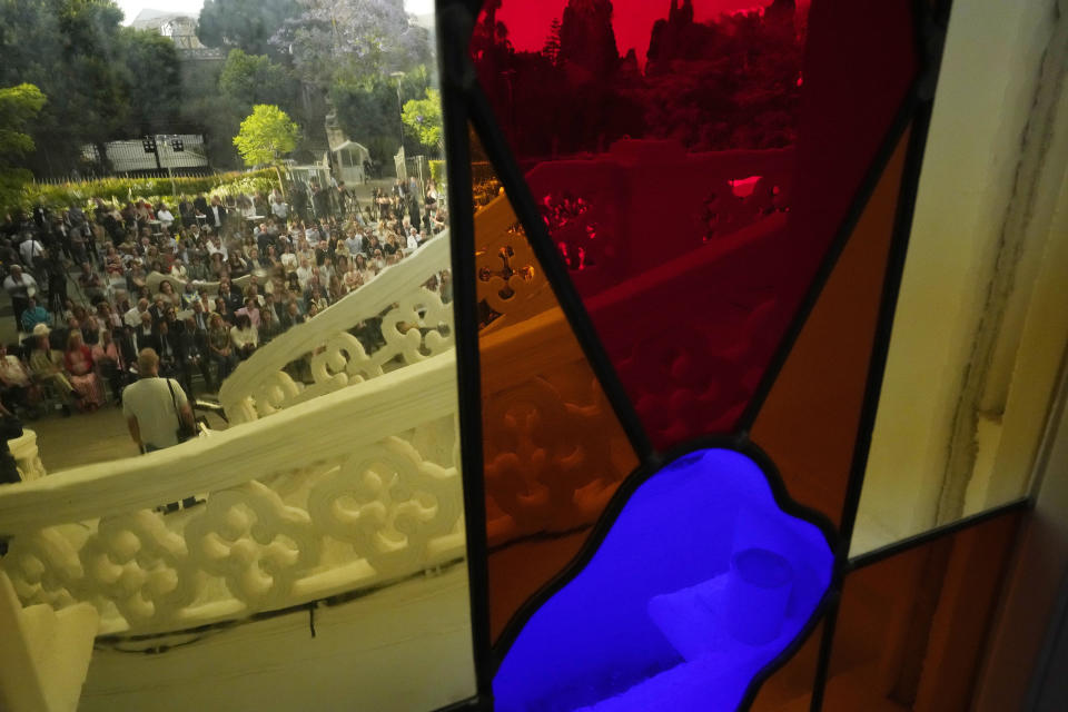 A crowd of people gather at the courtyard of the Sursock Museum during an opening event for the iconic venue in Beirut, Lebanon, Friday, May 26, 2023. The museum has reopened to the public, three years after after a deadly explosion in the nearby Beirut port reduced many of its treasured paintings and collections to ashes. (AP Photo/Hussein Malla)