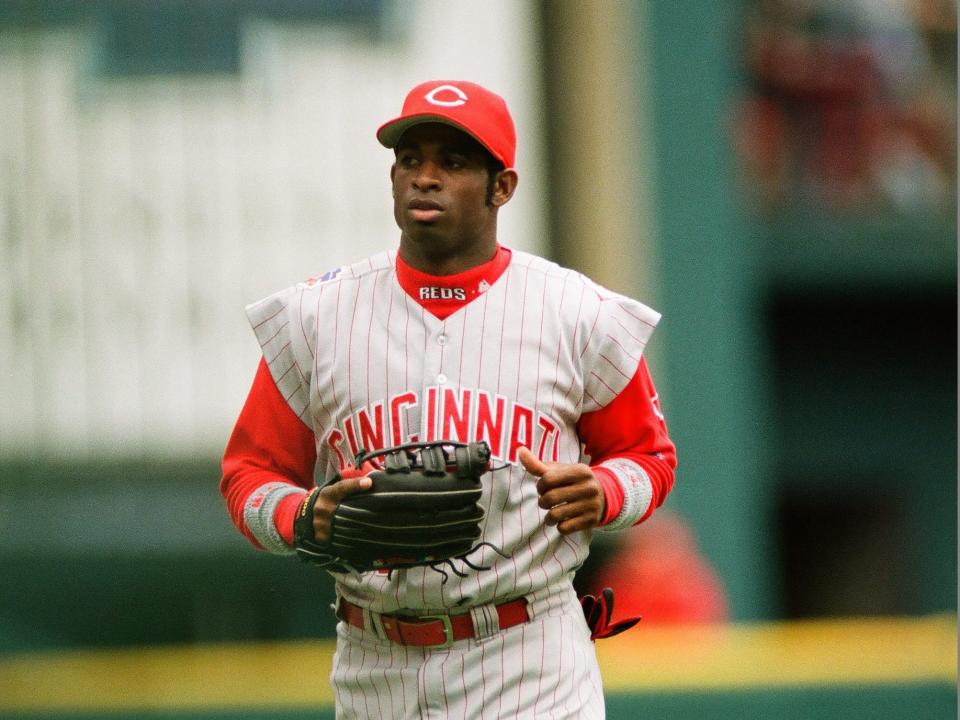 Deion Sanders in the outfield for the Cincinnati Reds.