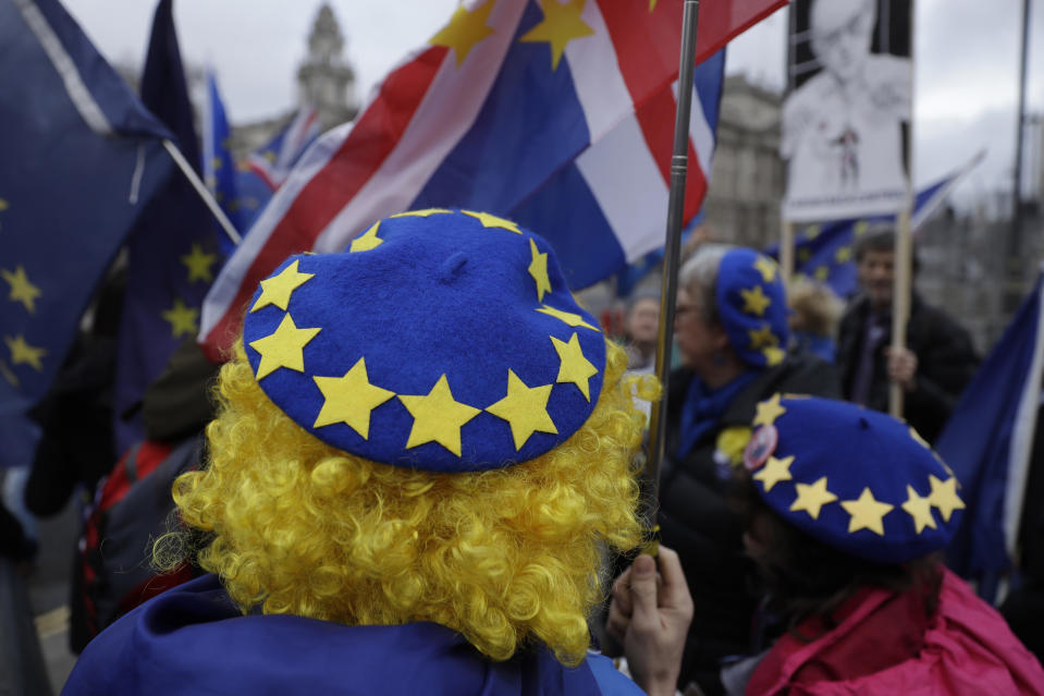 FILE - In this file photo dated Wednesday, Jan. 8, 2020, pro-Europe protesters demonstrate against Britain's Brexit split from the Bloc, outside the Houses of Parliament in London. Millions of Europeans who have freely lived, worked and studied in the U.K. for decades, now have to apply to stay under the “settlement” plan, but the deadline for applications is Wednesday June 30, 2021. From Thursday July 1, any European person who hasn’t applied will lose their legal right to work, rent housing, access some welfare and hospital treatments in the U.K. and campaigners say many thousands may not have applied by the deadline. (AP Photo/Matt Dunham, FILE)