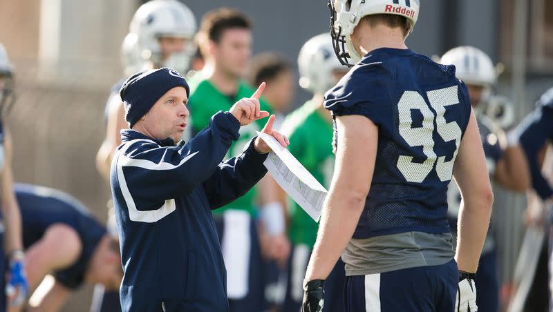 BYU tight ends coach Steve Clark works with players.