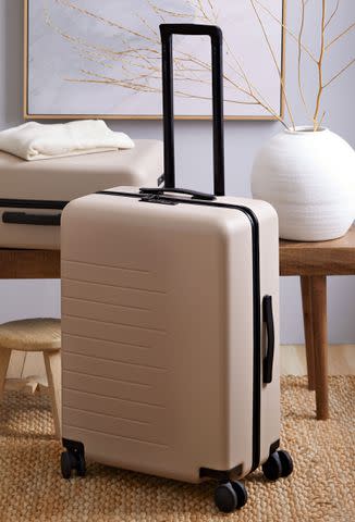 <p>Quince </p> Quince Check-In Hardshell Suitcase in Tan.