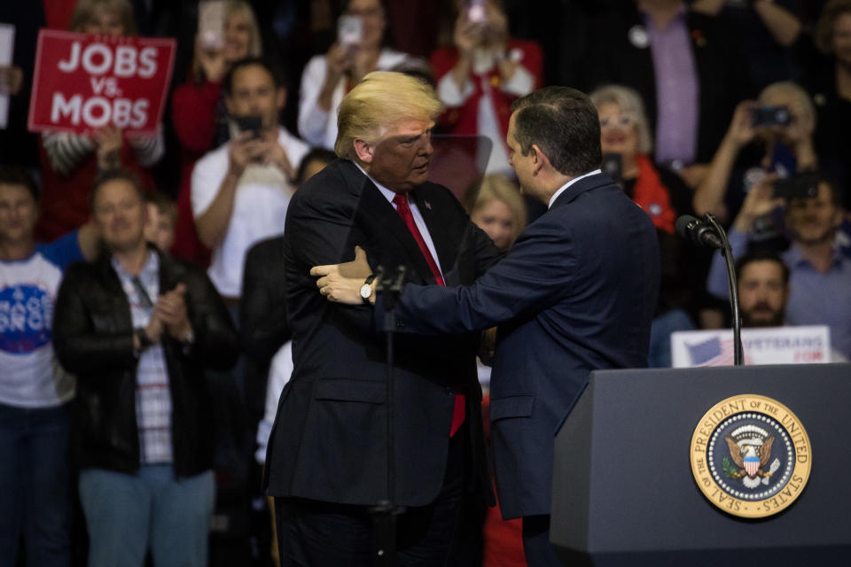 President Trump is brought on stage by Sen. Ted Cruz, R-Texas, during a rally on October 22 at the Toyota Center in Houston. (Photo by Loren Elliott/Getty Images)