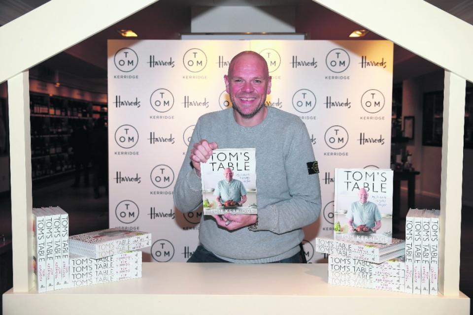 London, England - September 23: Chef Tom Kerridge poses with a copy of his book "Tom's Table: my favorite recipes" Bloomsbury title at Harrods on September 23, 2015 in London, England.  (Photo: Chris Jackson/Getty Images)