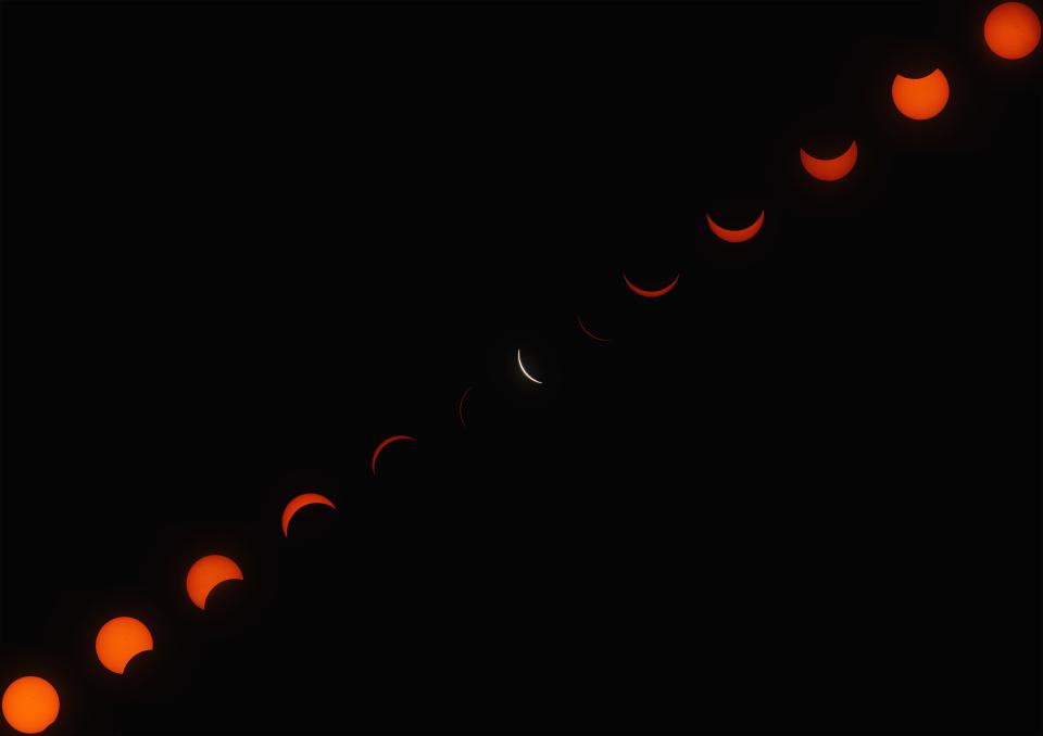 This composite image of 13 photographs shows the progression of the solar eclipse over 2 hours and 28 minutes during a watch party for the 2024 total solar eclipse held at Trumpet in the Land, the site of Ohio's official state play, Monday, April 8, in New Philadelphia. While New Philadelphia was not in the path of totality, viewers experienced 99.32% obscuration of the sun at 3:15 p.m., EDT.