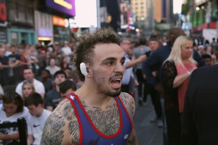 U.S. wrestler Jordan Oliver prepares to enter the ring at the "Beat The Streets" wrestling event in Times Square, New York City, U.S., May 17, 2017. REUTERS/Joe Penney