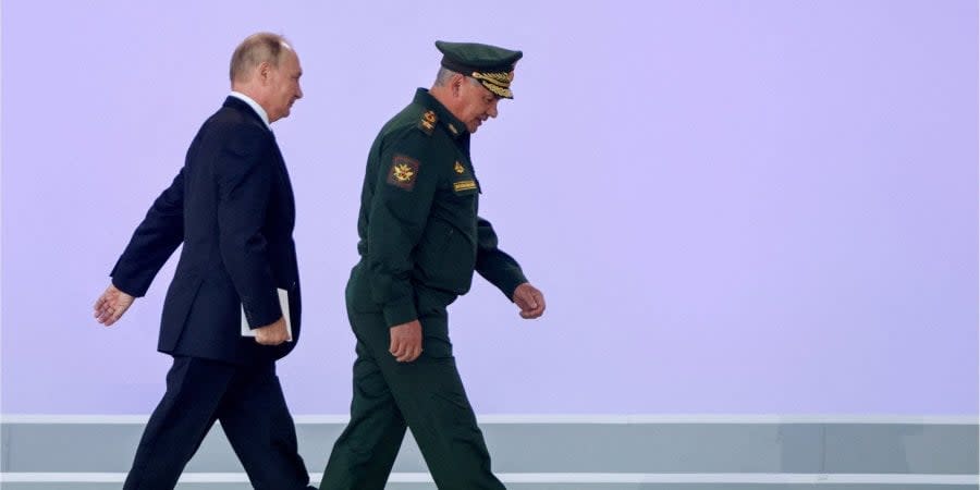 Russian dictator Vladimir Putin and Russian Defense Minister Sergei Shoigu