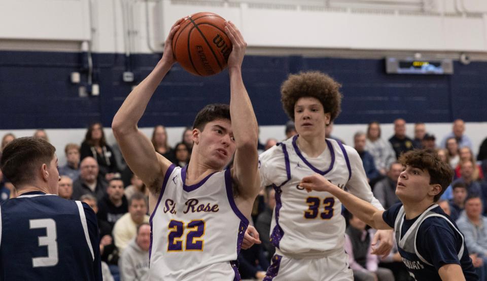 St. Rose's Gio Panzini grabs a rebound as teammate Jayden Hodge looks on during a 63-44 win over Manasquan on Jan. 22, 2024.