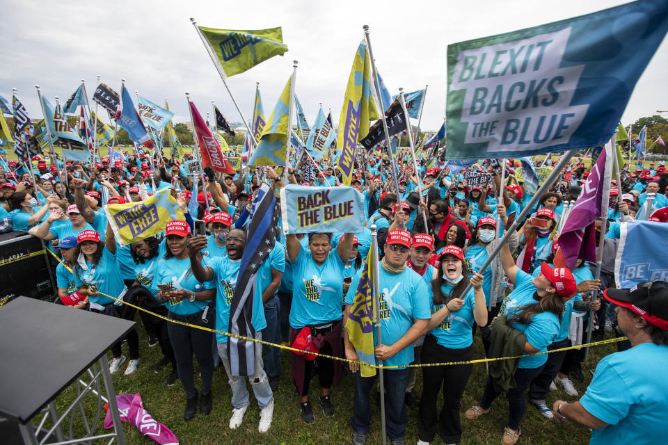 Supporters of President Donald Trump rally at The Ellipse, before entering to The White House, where Trump will hold an event on the South lawn on Saturday, Oct. 10, 2020, in Washington. (AP Photo/Jose Luis Magana)