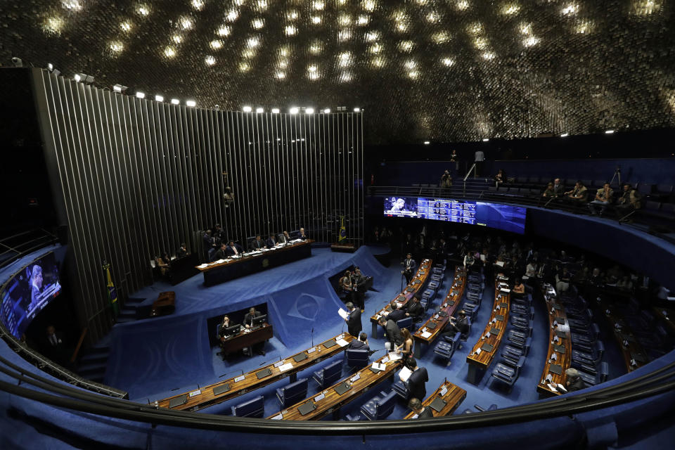The Senate holds a final vote on pension reform in Brasilia, Brazil, Tuesday, Oct. 22, 2019. The most meaningful impact of the reform is the establishment of a minimum age for retirement at 65 for men and 62 for women. (AP Photo/Eraldo Peres)