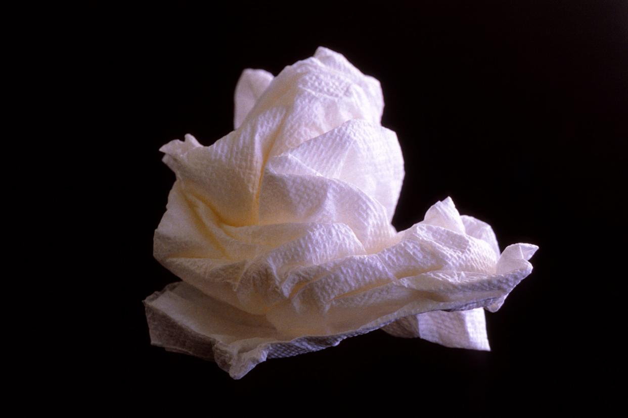 balled-up paper towel on a black surface