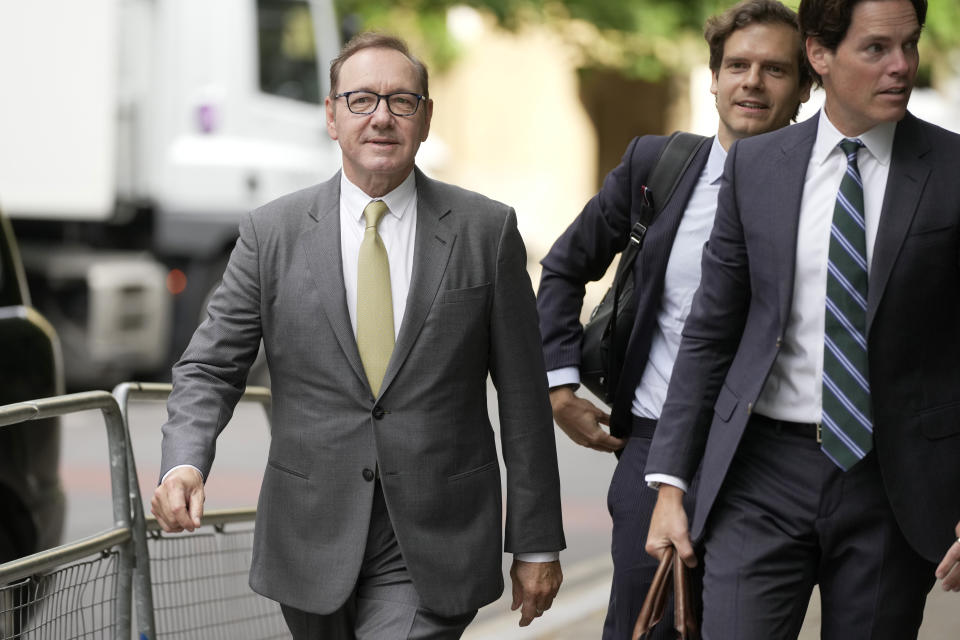 Actor Kevin Spacey, left, arrives at Southwark Crown Court in London, Friday, June 30, 2023. Spacey is going on trial on charges he sexually assaulted four men as long as two decades ago. The double-Oscar winner faces a dozen charges at Southwark Crown Court. Spacey pleads not guilty to all charges. (AP Photo/Kin Cheung)