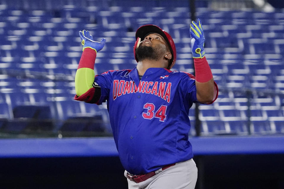 Dominican Republic's Juan Francisco celebrate his home run in the fourth inning of of a baseball game against South Korea at the 2020 Summer Olympics, Sunday, Aug. 1, 2021, in Yokohama, Japan. (AP Photo/Sue Ogrocki)