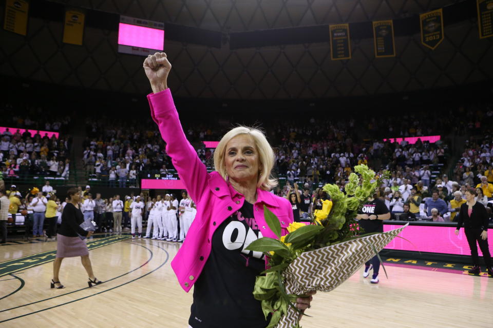 Baylor head coach Kim Mulkey thanks the fans as she is is congratulated for her 600 wins before an NCAA college basketball game against Oklahoma, Saturday, Feb. 22, 2020, in Waco, Texas. (AP Photo/ Jerry Larson)