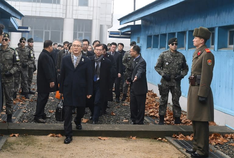 South Korea's chief delegate Lee Woo-Sung (front L) and his delegation attend inter-Korea talks on the North's side of the border at the truce village of Panmunjom