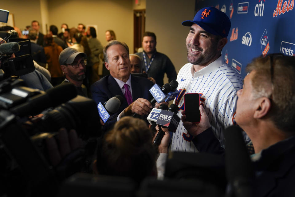 New York Mets baseball pitcher Justin Verlander talks with reporters at a news conference at Citi Field, Tuesday, Dec. 20, 2022, in New York. The team introduced Verlander after they agreed to a $86.7 million, two-year contract. It's part of an offseason spending spree in which the Mets have committed $476.7 million on seven free agents. (AP Photo/Seth Wenig)