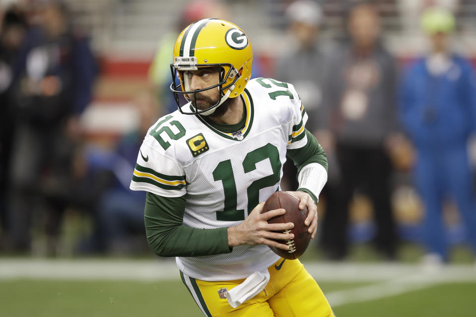 Green Bay Packers quarterback Aaron Rodgers (12) rolls out during the first half of the NFL NFC Championship football game against the San Francisco 49ers Sunday, Jan. 19, 2020, in Santa Clara, Calif. (AP Photo/Ben Margot)