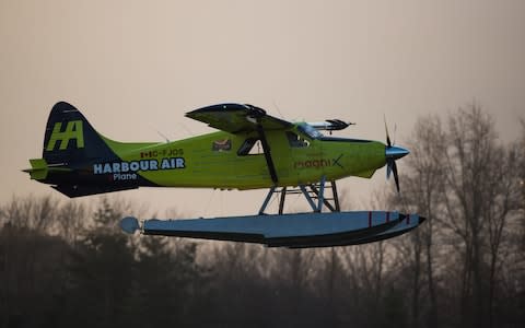 The world's first fully electric commercial aircraft took off from the Canadian city of Vancouver where tall mountain peaks edge the Pacific Ocean - Credit: Darryl Dyck/Bloomberg