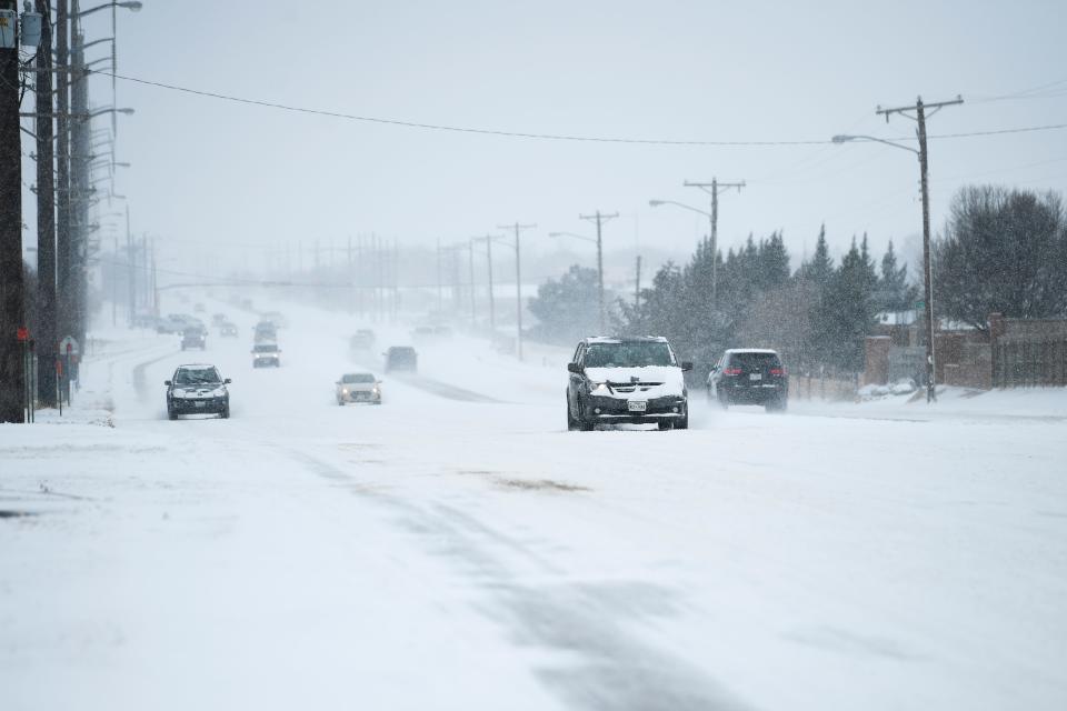Vehicles travel north on Milwaukee during the snow storm on Tuesday, Feb. 16, 2021, in Lubbock, Texas. [Justin Rex/For A-J Media]