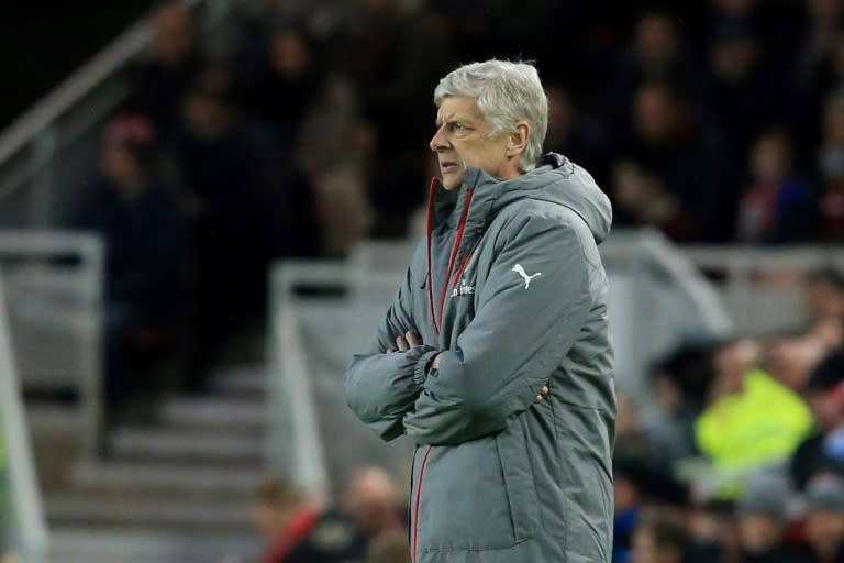 Arsenal's manager Arsene Wenger watches his players from the touchline on April 17, 2017