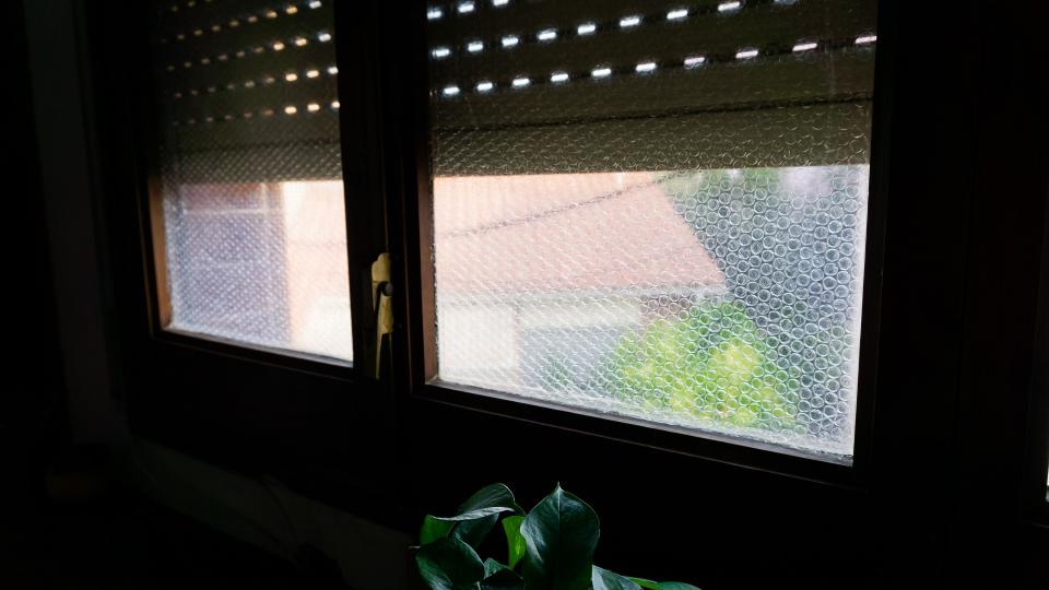Window glass lined with bubble wrap stock photo