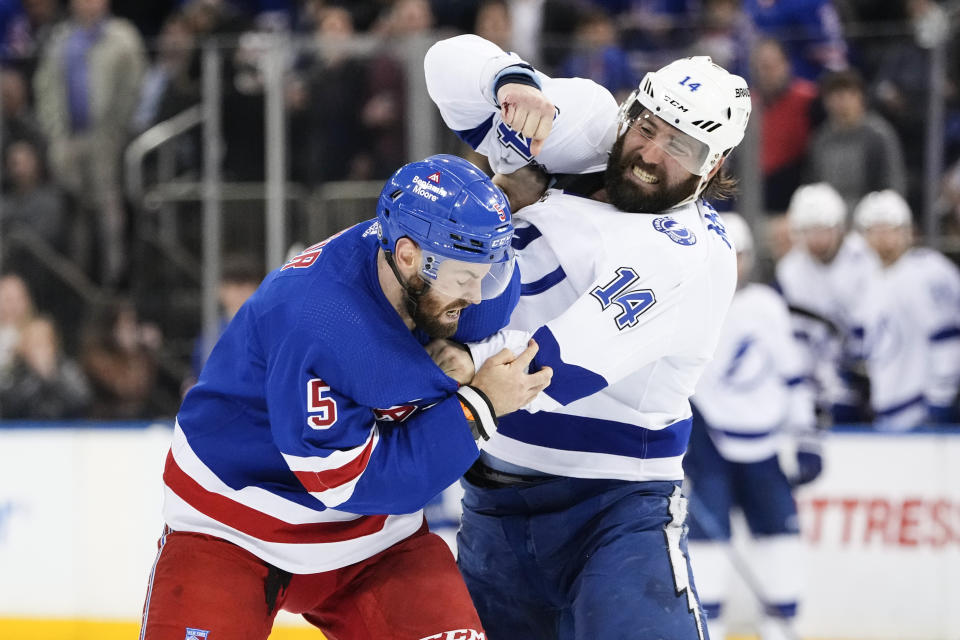 Tampa Bay Lightning's Pat Maroon (14) fights with New York Rangers' Ben Harpur (5) during the first period of an NHL hockey game Wednesday, April 5, 2023, in New York. (AP Photo/Frank Franklin II)