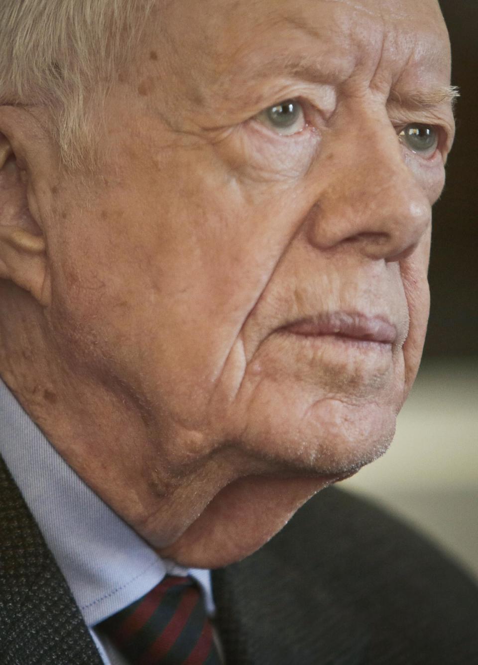Former U.S. President Jimmy Carter listens during an interview on Monday March 24, 2014 in New York. Carter said Monday that he doesn't support the Palestinian-led "boycott, divest, sanction" campaign against Israel but said products made in Israel-occupied Palestinian territories should be clearly labeled so buyers can make a choice about them. (AP Photo/Bebeto Matthews)