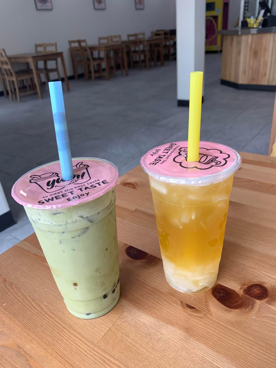 Matcha milk tea with traditional boba, left, and mango and passionfruit tea with lychee jelly are two of many boba bar options at Poke & Roll in Cuyahoga Falls.