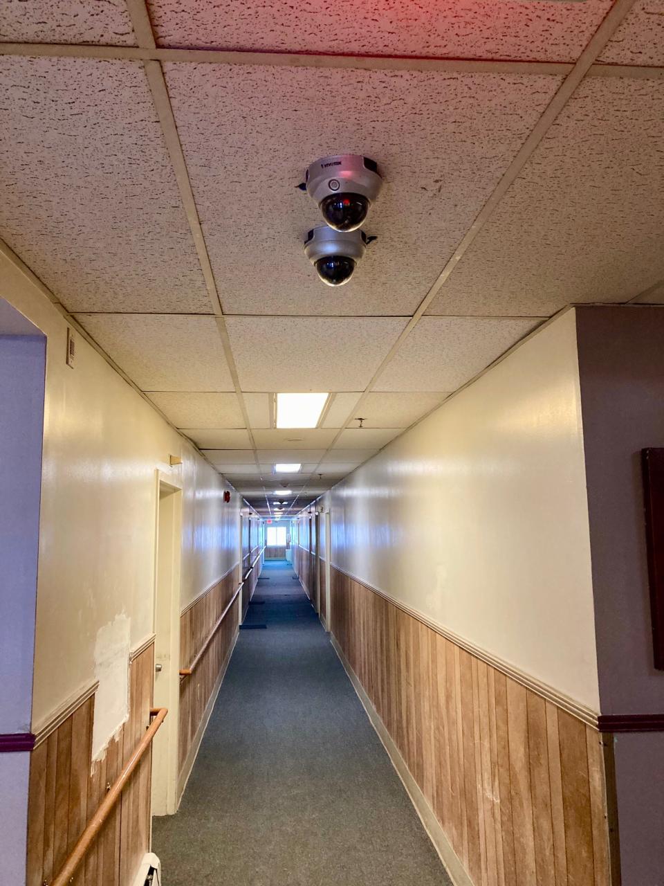 Security cameras inside a hallway at Herring Manor, a subsidized apartment building for seniors and the disabled in Wilmington.