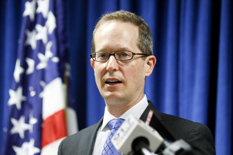 U.S. Attorney Benjamin C. Glassman speaks during a news conference, Wednesday, Oct. 10, 2018, in Cincinnati. The Justice Department says a Chinese intelligence operative has been charged with stealing trade secrets from multiple U.S. aviation and aerospace companies. Yanjun Xu was charged Wednesday with conspiring and attempting to commit economic espionage and theft of trade secrets. (AP Photo/John Minchillo)