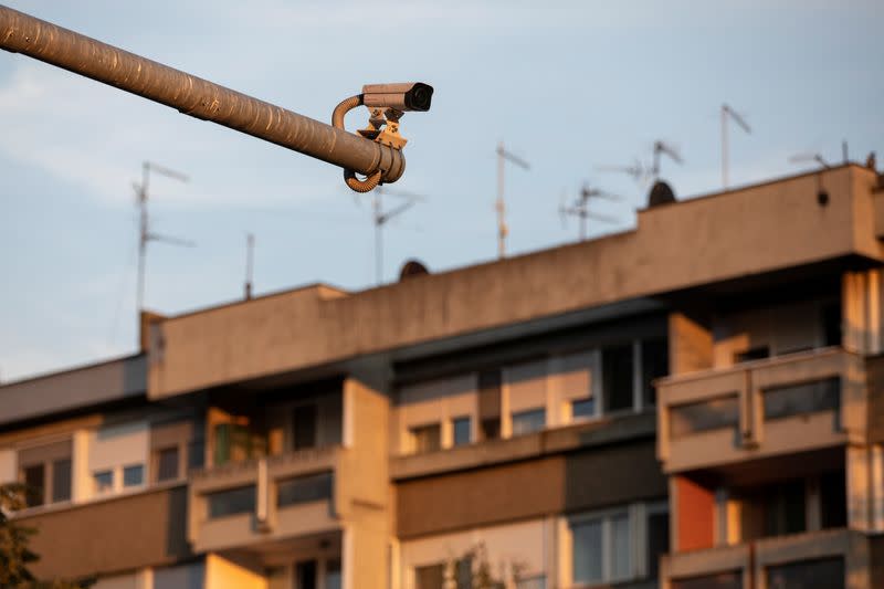 A surveillance camera is seen in front of a residential building in Belgrade
