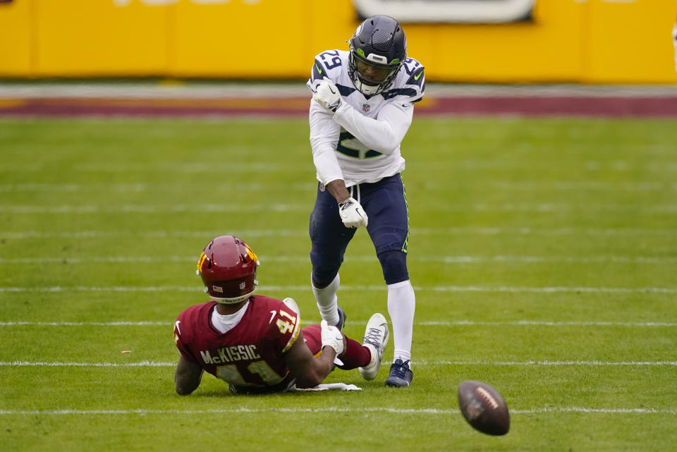 Seattle Seahawks free safety D.J. Reed (29) reacting after stopping Washington Football Team running back J.D. McKissic (41) from catching the ball during the first half of an NFL football game, Sunday, Dec. 20, 2020, in Landover, Md. (AP Photo/Andrew Harnik)