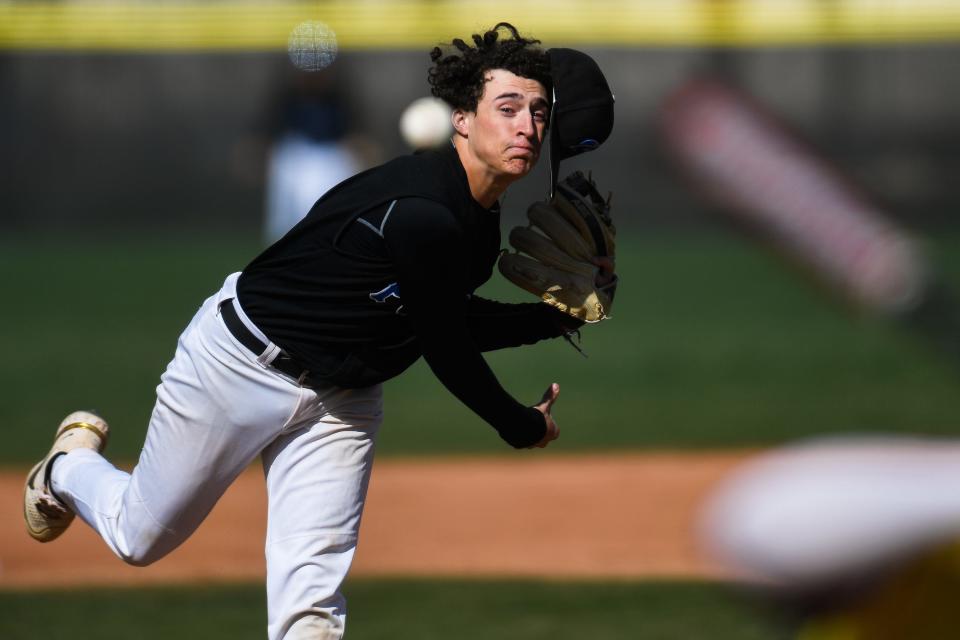 Poudre's Brayden Bay (2) loses his hat as he delivers a pitch during a high school baseball game against Rocky Mountain at Rocky Mountain High School in Fort Collins on April 20, 2023.