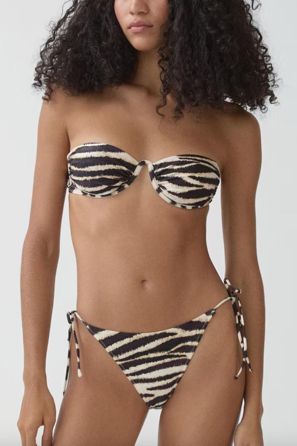 <p><a href="https://go.redirectingat.com?id=74968X1596630&url=https%3A%2F%2Fshop.mango.com%2Fus%2Fwomen%2Fbikinis-and-swimsuits-bikinis%2Funderwired-bikini-top_67024014.html&sref=https%3A%2F%2Fwww.elle.com%2Ffashion%2Fshopping%2Fg60104624%2Fbest-underwire-swimsuits%2F" rel="nofollow noopener" target="_blank" data-ylk="slk:Shop Now;elm:context_link;itc:0;sec:content-canvas" class="link ">Shop Now</a></p><p>Underwired swimsuit Top</p><p>mango.com</p><p>$39.99</p>