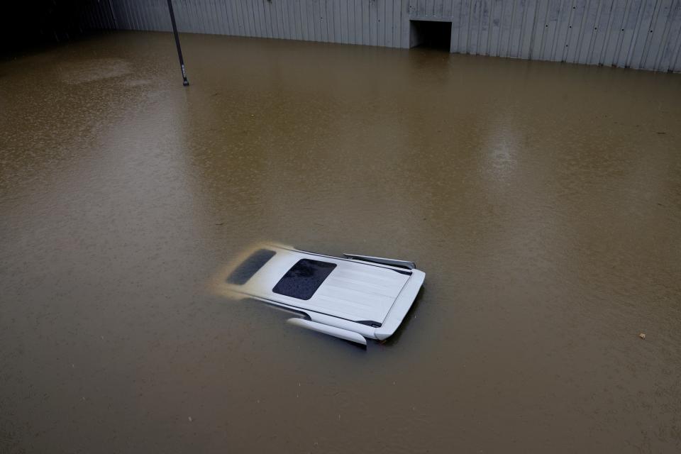 A view of a vehicle submerged at a flooded area after heavy rains, in Hong Kong, China
