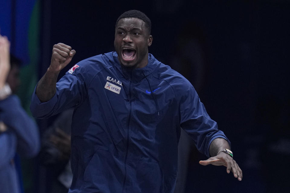 Greece forward Thanasis Antetokounmpo (43) cheers from the bench during the second half of a Basketball World Cup second-round match against Montenegro in Manila, Philippines Sunday, Sept. 3, 2023. (AP Photo/Michael Conroy)