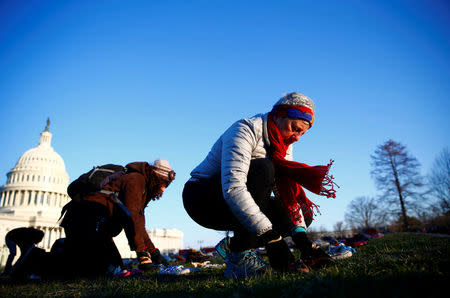 Activists install 7000 shoes on the lawn in front of the U.S. Capitol on Capitol Hill in Washington, U.S. March 13, 2018. REUTERS/Eric Thayer