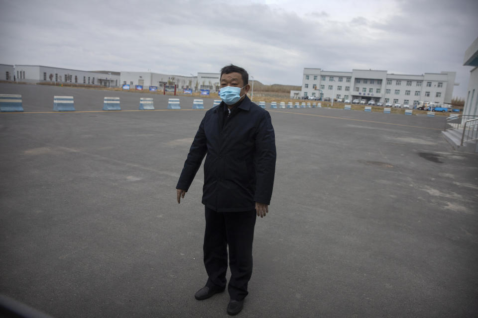 Urumqi Public Security Bureau director Zhao Zhongwei stands in a parking lot outside the inmate detention area at the Urumqi No. 3 Detention Center in Dabancheng in western China's Xinjiang Uyghur Autonomous Region on April 23, 2021. (AP Photo/Mark Schiefelbein)