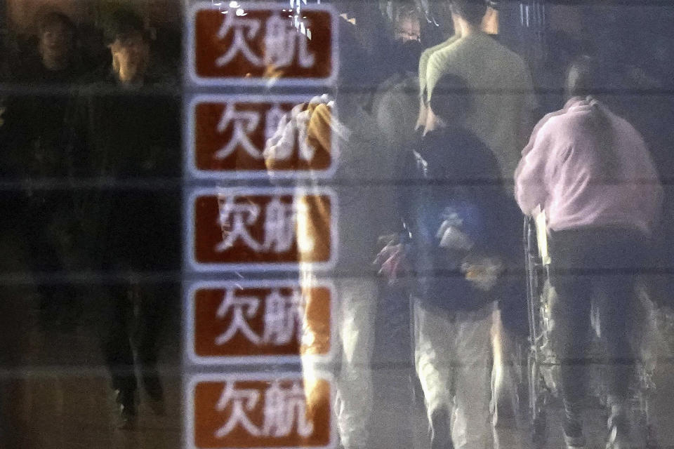 A flight information board shows cancellation of the flights at Haneda airport in Tokyo Saturday, Jan. 6, 2024. The 379 passengers of Japan Airlines Flight JAL-516 didn't expect their plane to burst into flames just as it was about to touchdown at Tokyo’s Haneda airport Tuesday evening, on Jan. 2, 2024. A smaller coast guard Bombardier Dash-8 aircraft, preparing to take off to deliver urgent aid to quake-hit central Japan, was using the same runway when the two collided. The Associated Press collected accounts from witnesses, officials and transcripts of the traffic controls communication. (Kyodo News via AP)