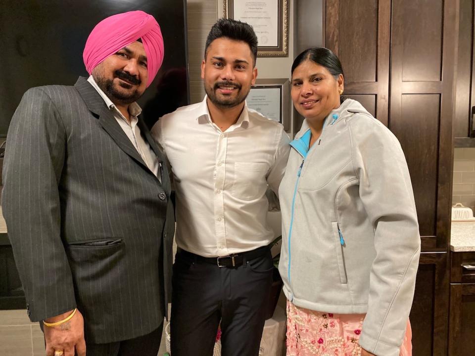 Vikramjit Brar (middle) has lived in Canada for over 15 years and sponsored his parents to become permanent residents of Canada five years ago. He says he's desperate for answers.